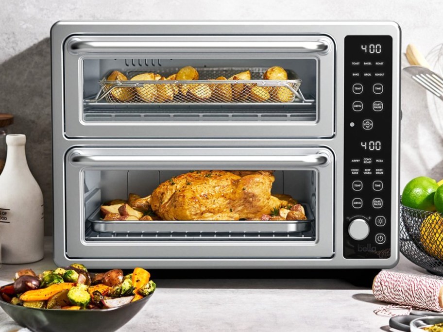 countertop double oven with chicken and potatoes inside