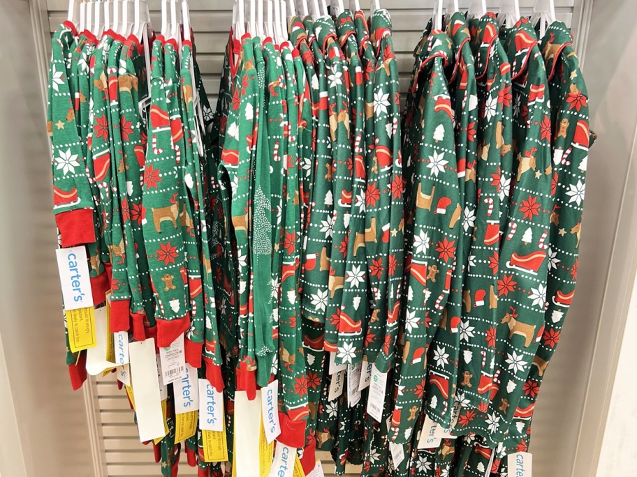 carter's christmas pajamas hanging on hangers