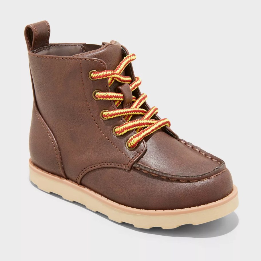 stock photo of brown toddler boot with yellow laces