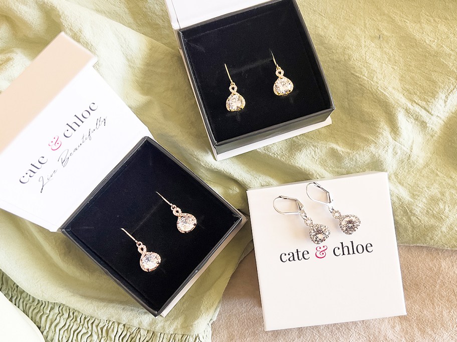 multiple pairs of earrings in gift boxes