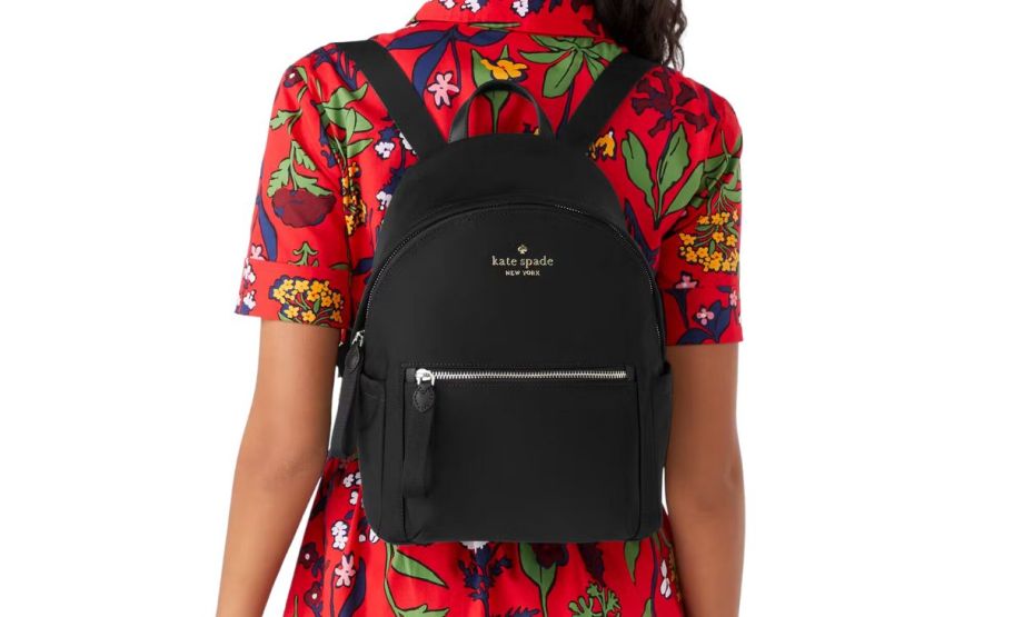 a woman wearing a black backpack