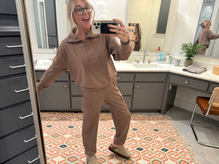 woman wearing tan tracksuit