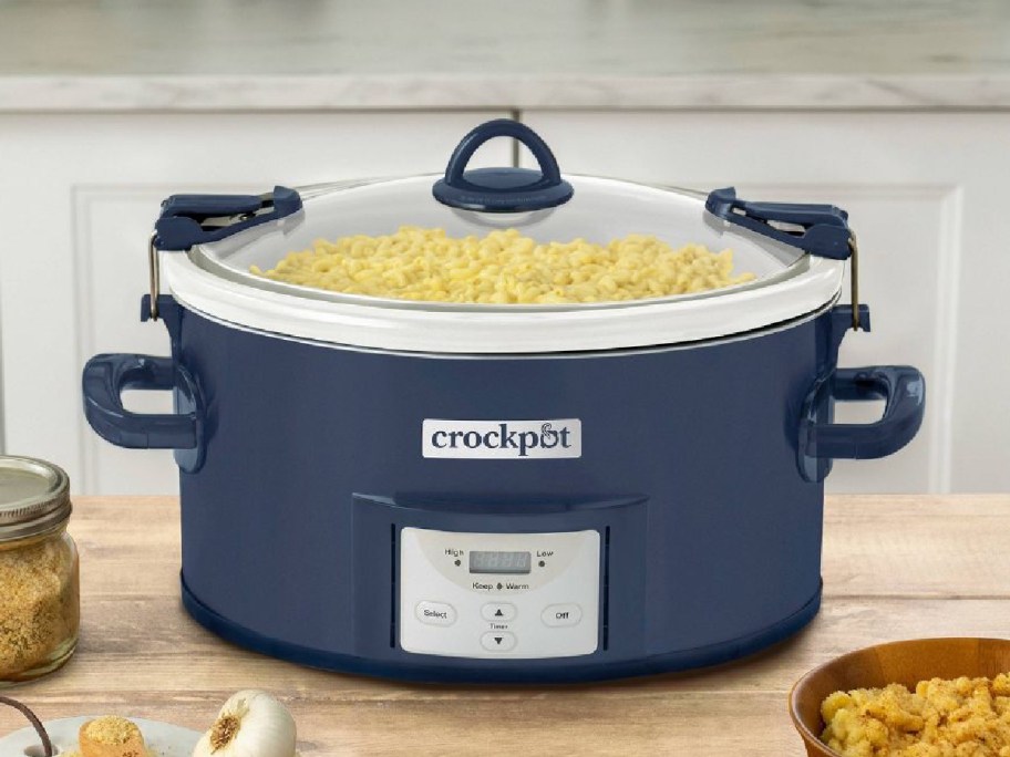 Crock-Pot 7-Quart Cook & Carry One Touch Programmable Slow Cooker sitting on the counter