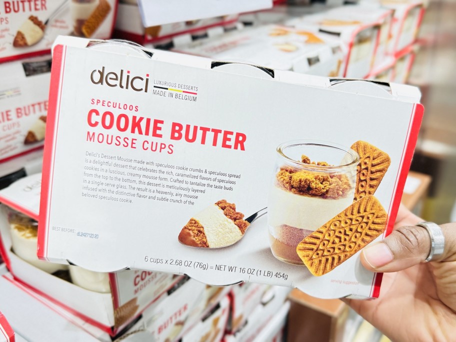 hand holding up a set of Delici Speculoos Cookie Butter Mousse Cups in store