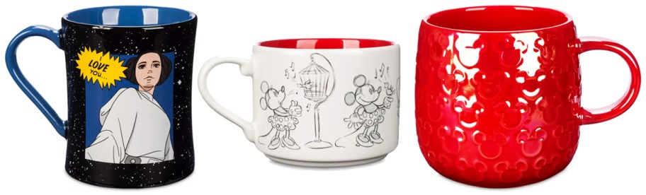 three disney coffee mugs in a row