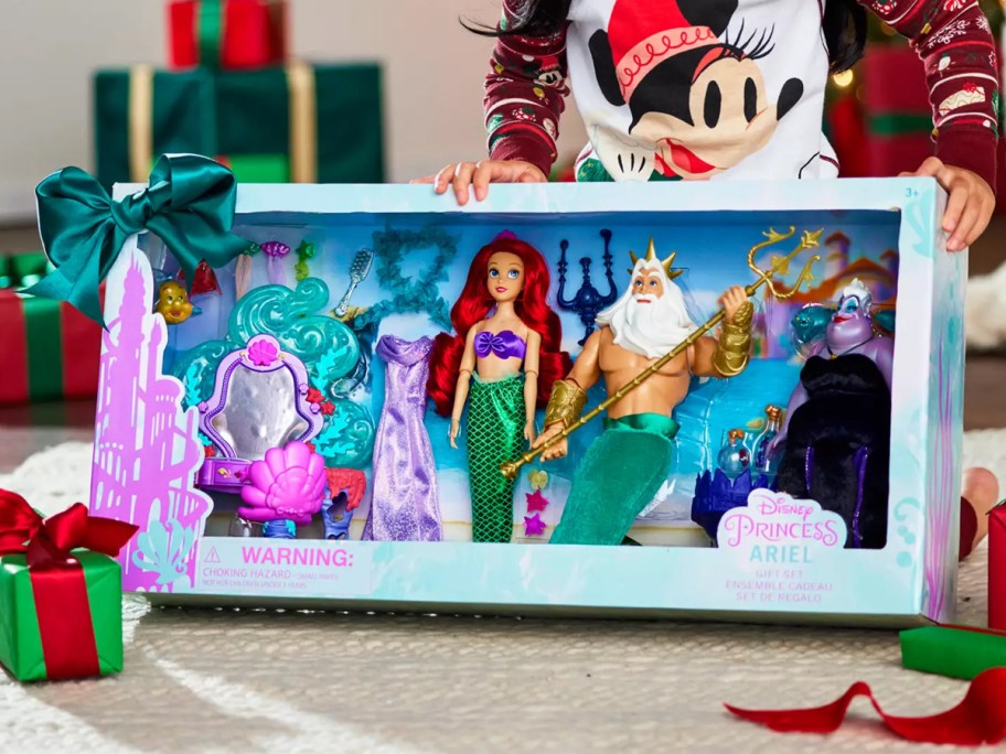 girl unwrapping Disney The Little Mermaid Classic Doll Gift Set