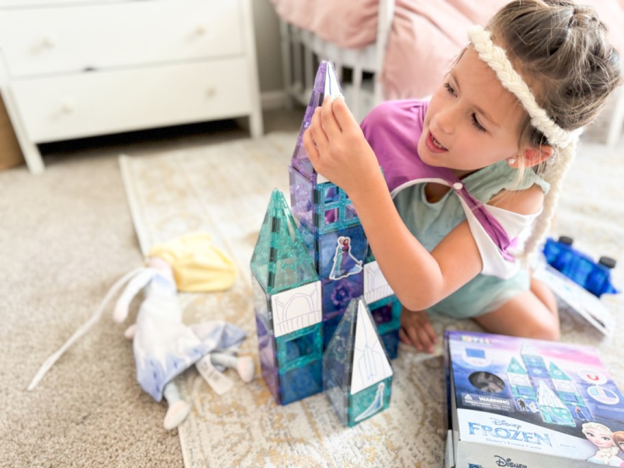 little girl playing with Disney Tytan Tiles Frozen in her room