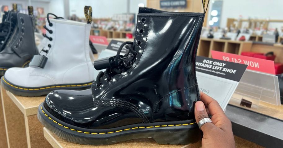 A pair of patent leather dr. Martens boots