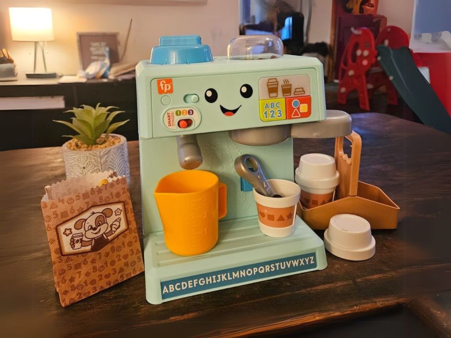 Fisher-Price Laugh & Learn & Serve Coffee Cafe Playset on a counter