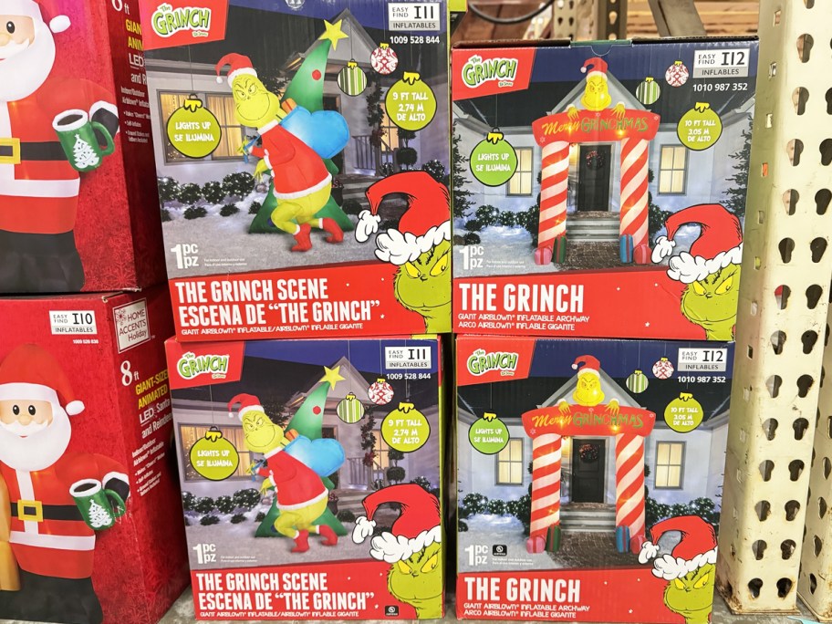 boxes of grinch themed inflatables in store shelf