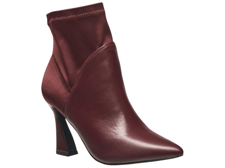 An H by Halston Iza Boot with a heel in burgandy