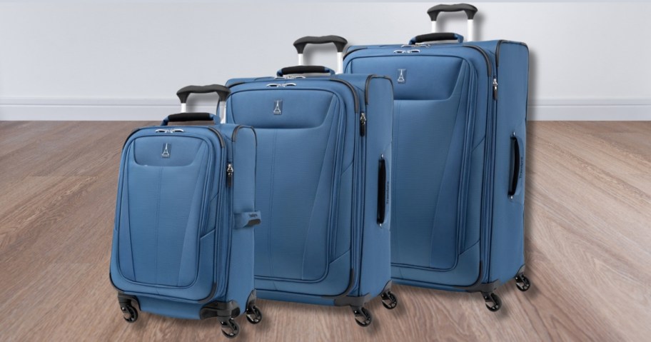 a set of 3 blue color softside spinner luggage pieces in 3 different sizes