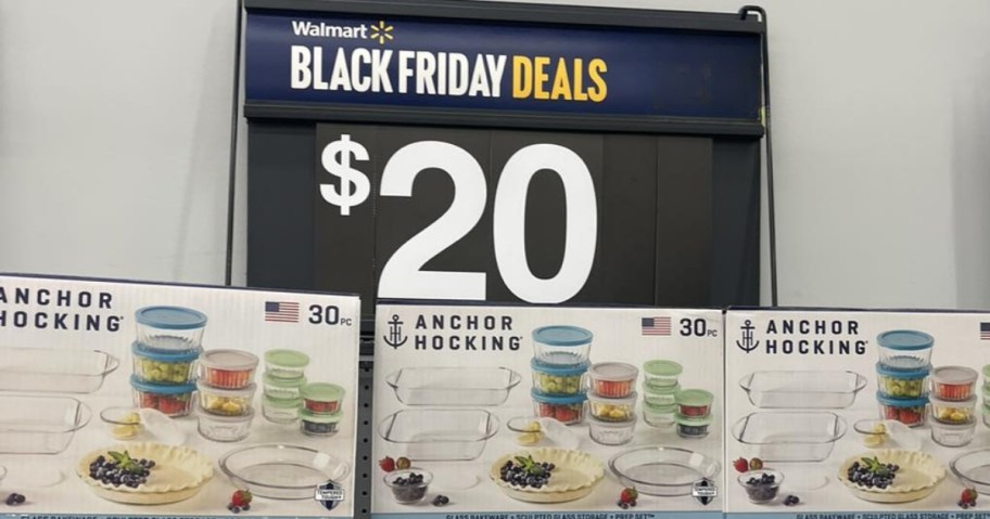 a large sign that says Walmart Black Friday Deals and $20 above a shelf with boxes of Anchor Hocking sets with bowls, lids, and baking dishes in them