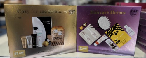 2 beauty gift sets in boxes on a store shelf