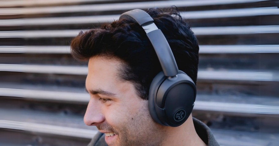 man wearing a pair of black Jlab wireless headphones