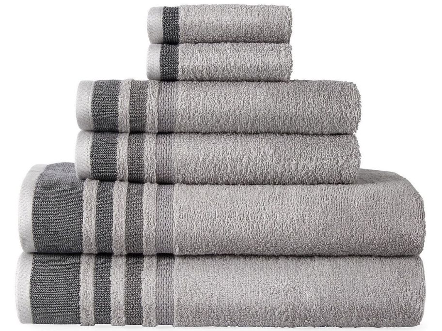 A stack of Home Expressions striped bath towels