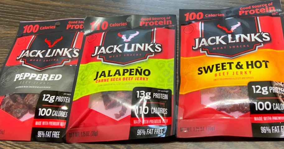 three bags of Jack Links beef jerky on table