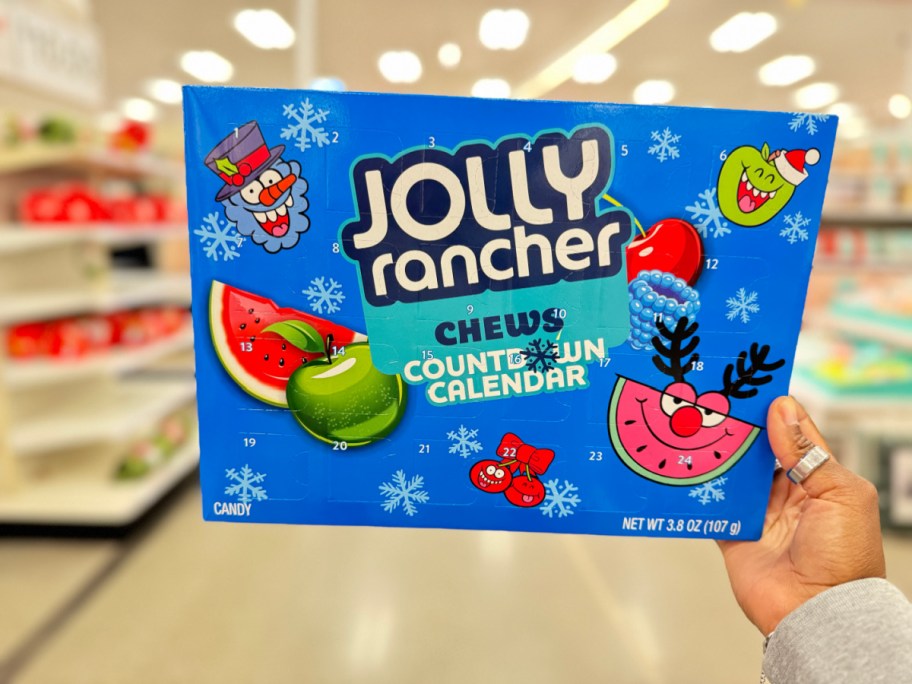 Hand holding up a Jolly Rancher Advent Calendar from Target