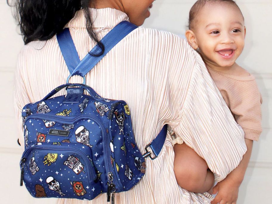 Woman wearing a Jujube Backpack