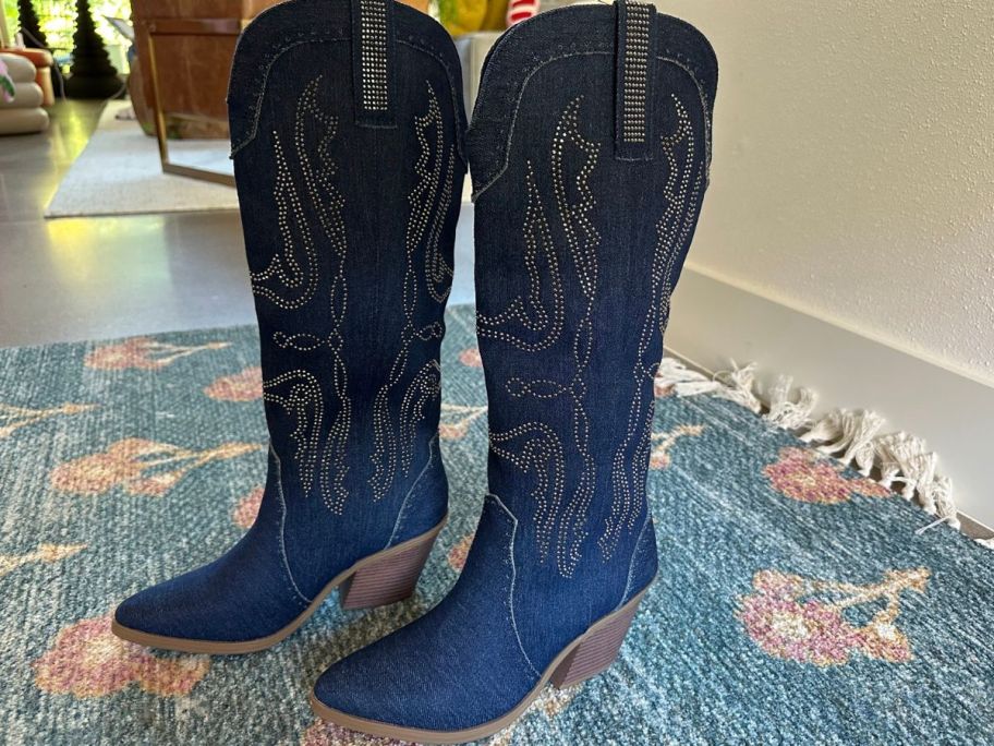 A pair of SO Briely Women's Tall Western Boots in denim color