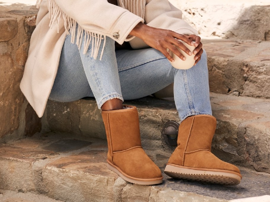 woman wearing brown Koolaburra by UGG Boots