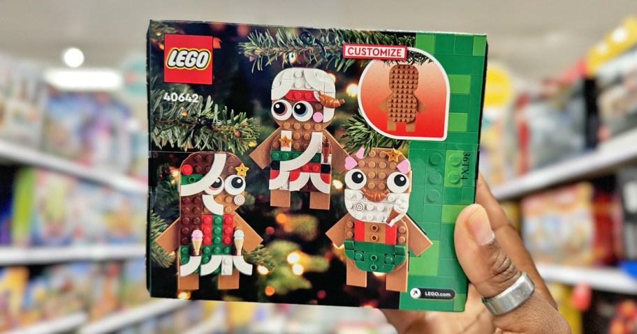 hand holding up LEGO Gingerbread Ornaments Set in store