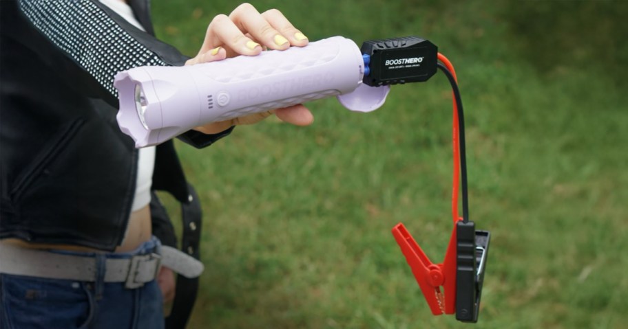 Limitless BoostHero Jump Starter, Power Bank & Flashlight being held by a woman