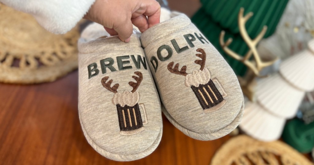 person holding up pair of Mens Brew Dolph Slippers