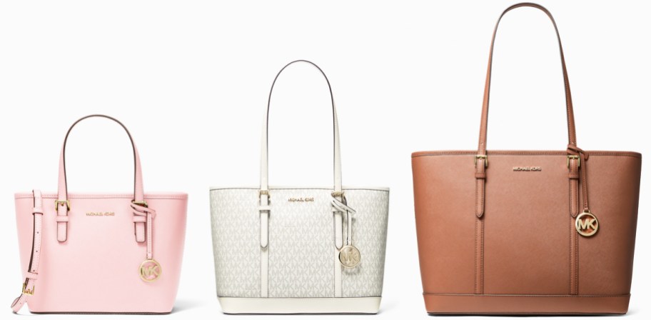 three michael kors tote bags in a row