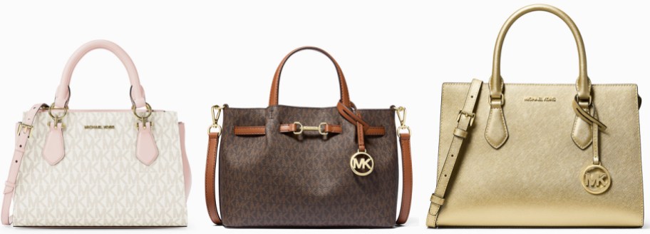 three michael kors purses in a row