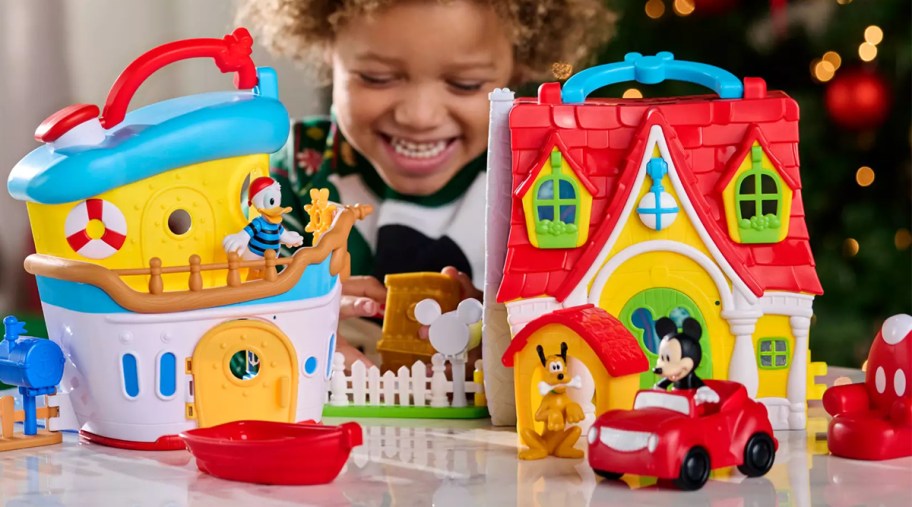 boy playing with Mickey Mouse and Donald Duck Playhouse Set