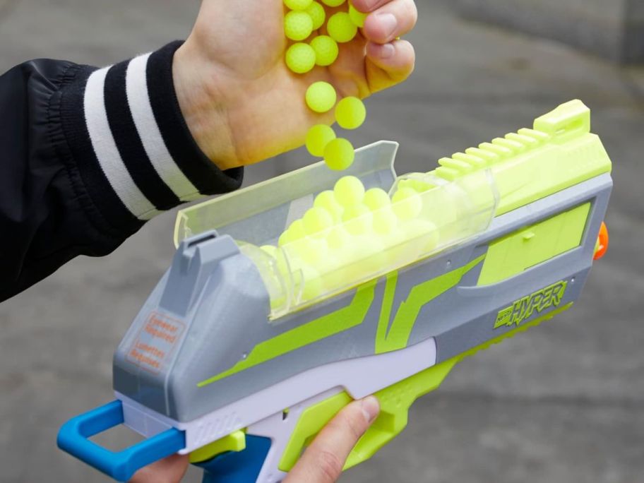 hand loading rounds into a Nerf Hyper Blaster