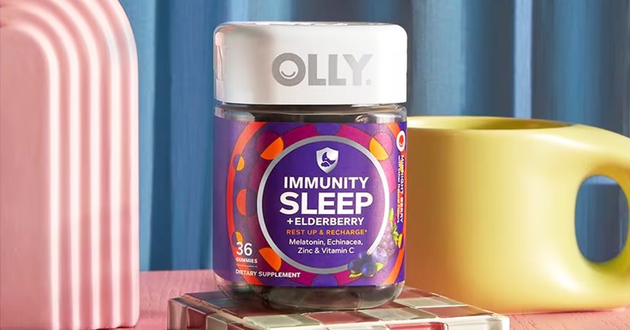 bottle of OLLY Immunity Sleep near yellow mug