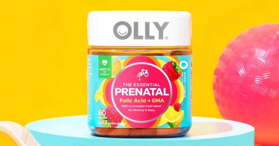 bottle of OLLY Prenatal Gummy Multivitamins with yellow background