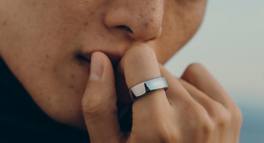 Person wearing an Oura ring on their pointer finger