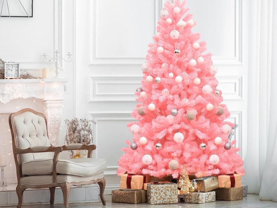 pink christmas tree decorated with ornaments on display in home