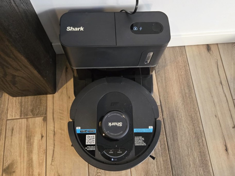 black shark robot vacuum on its base