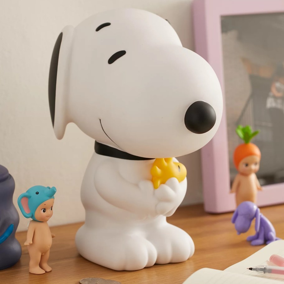 Peanuts Snoopy Coin Bank figure on table