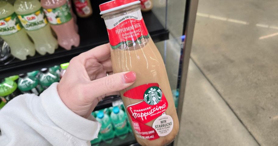 Hand holding a bottled Starbucks Peppermint Mocha Frappuccino