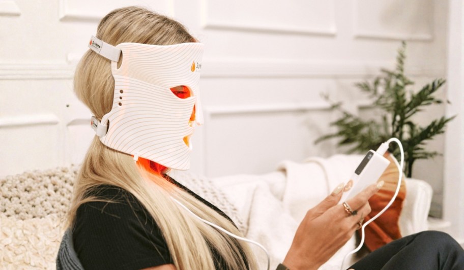 woman wearing Sun Home radiant red light face mask