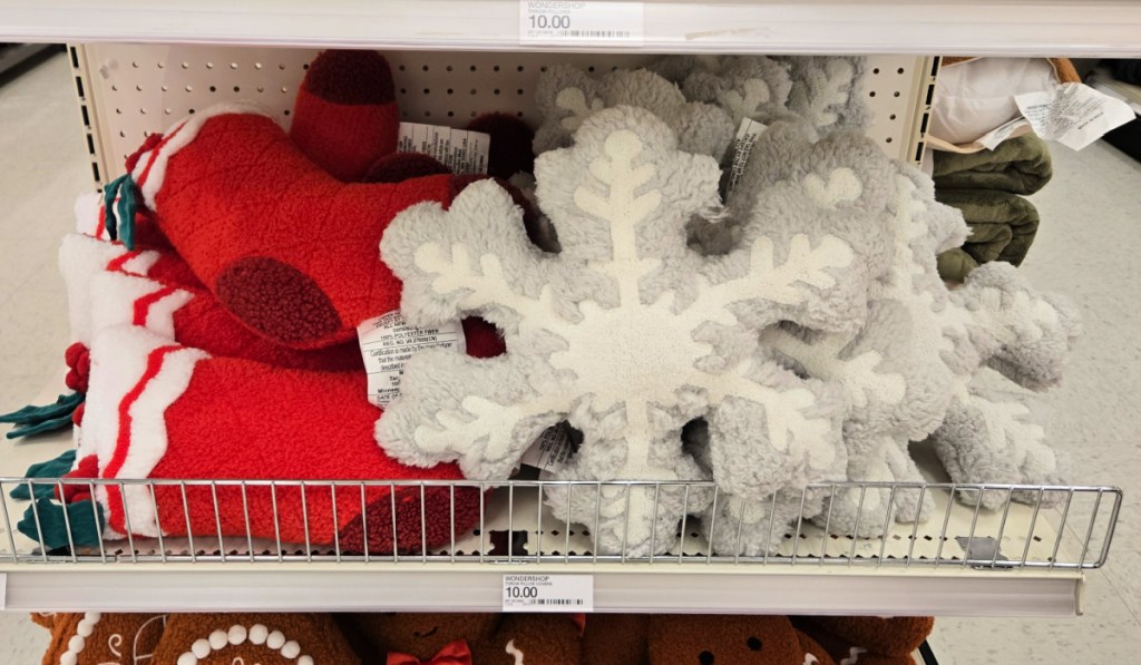 Snowflake and stocking shaped throw pillows inside target store