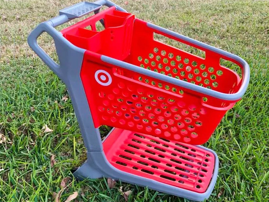 red Target Kids Shopping Cart on a lawn