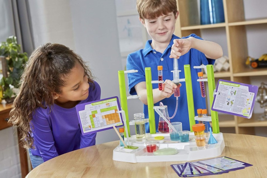 kids playing with a Thames & Kosmos Chemistry Set