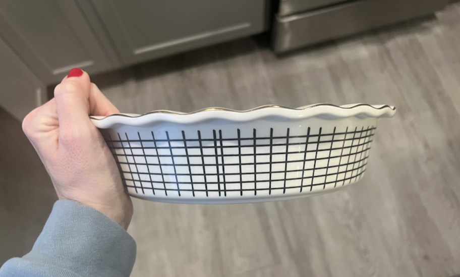 hand holding a checkered pie dish 