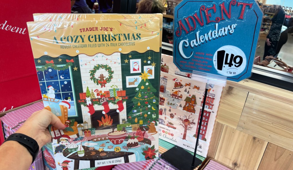 Person inside Trader Joe's store showing off chocolate advent calendar