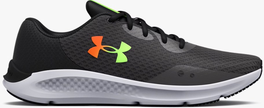 black running shoe with orange and yellow under armour logo