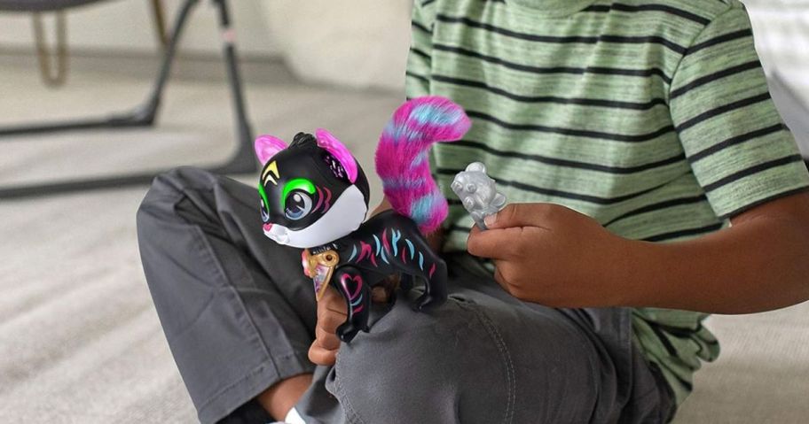 boy holding vteach sparklings tiger toy