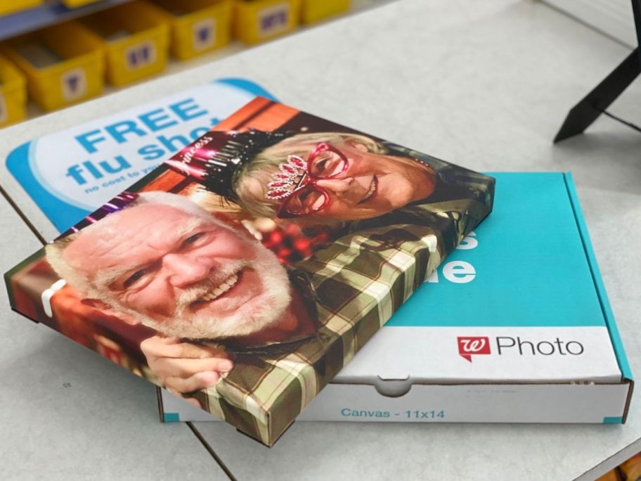 A Walgreens Photo Canvas on the box on a Walgreens counter