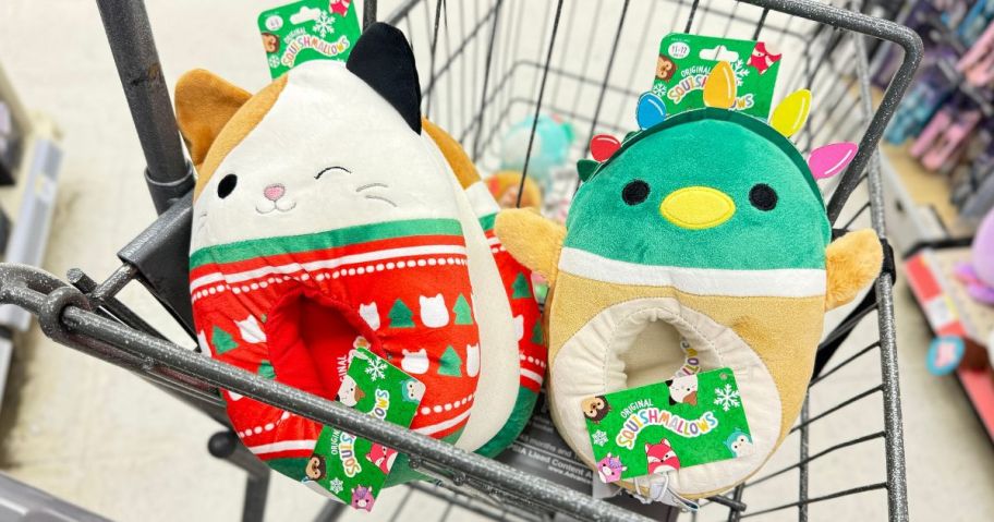 A Walgreens shopping cart with two squishmallows holiday slippers in it