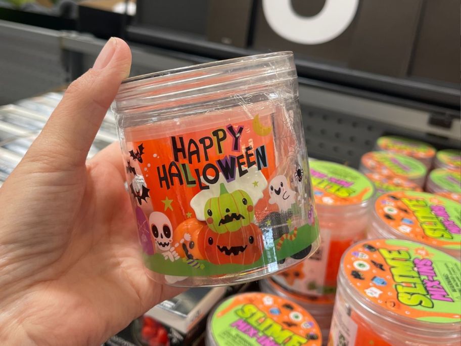 Hand holding a jar of Way to Celebrate Halloween Slime